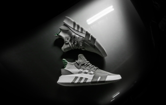 grayscale photo pair of adidas shoes